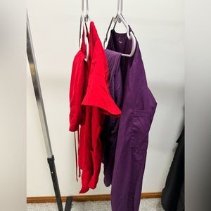 2 pair of scrubs. Red short sleeve scrubs & Purple long sleeve scrubs